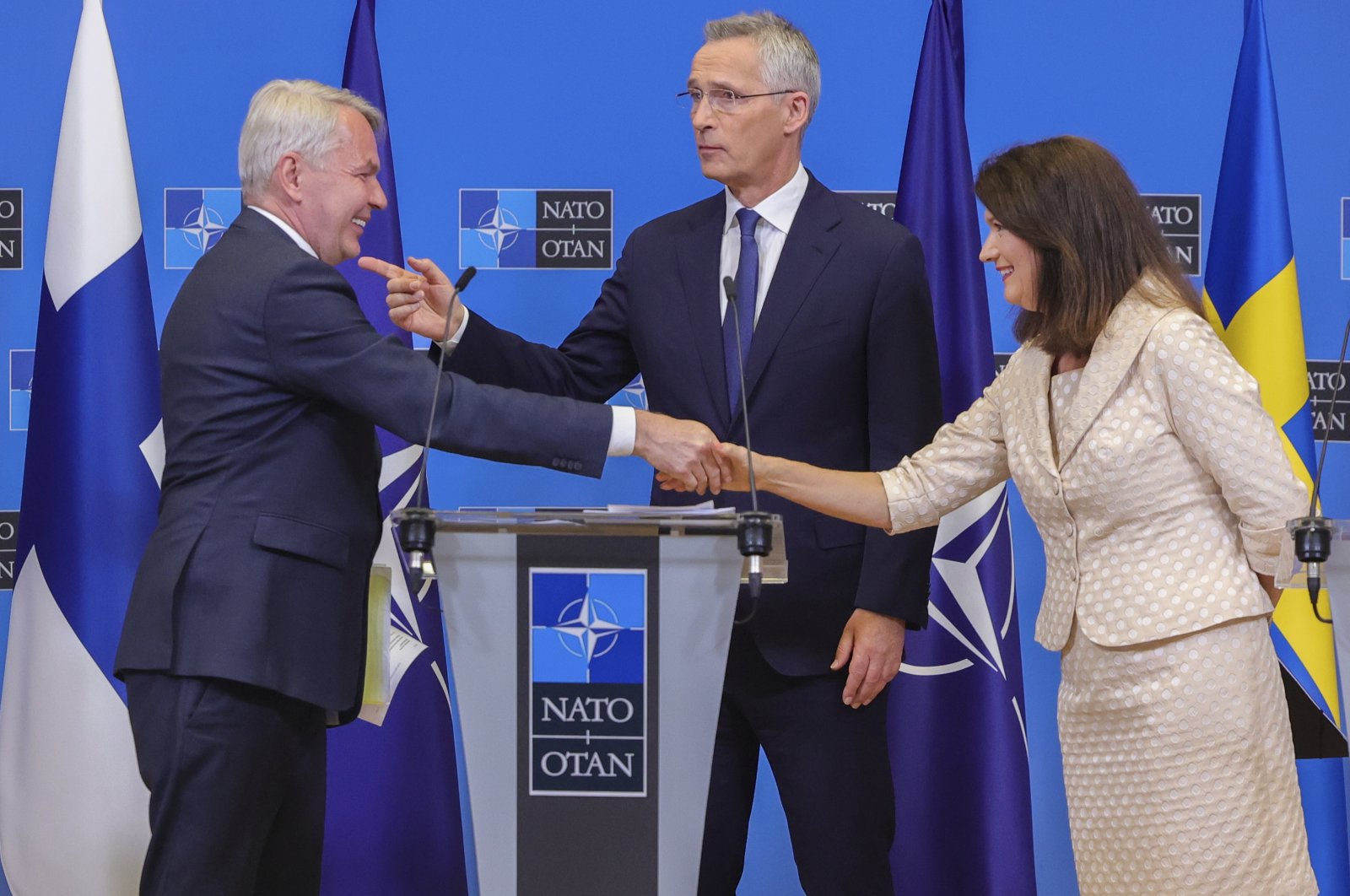 Finland&#039;s Foreign Minister Pekka Haavisto, left, Sweden&#039;s Foreign Minister Ann Linde, right, and NATO Secretary-General Jens Stoltenberg attend a media conference after the signature of the NATO Accession Protocols for Finland and Sweden in the NATO headquarters in Brussels, Tuesday, July 5, 2022. (AP Photo/Olivier Matthys)