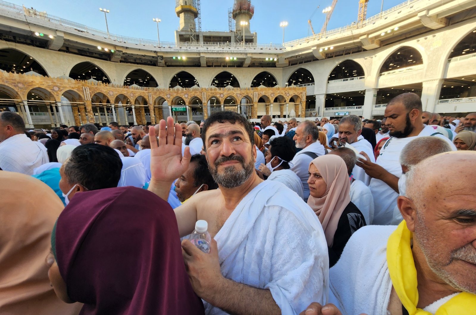 Adam Muhammed waves inside the Masjid Al-Haram in Mecca, Saudi Arabia, July 5, 2022. (AA Photo)