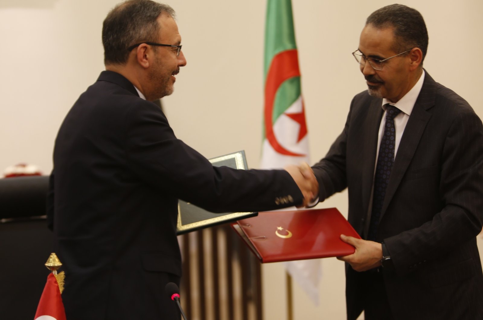 Sports Minister Mehmet Kasapoğlu (L) and his Algerian counterpart Abdel Razzaq Sabbak shake hands after signing a series of agreements, Algiers, Algeria, July 5, 2020. (AA Photo)