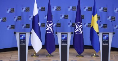 Flags of Finland, NATO and Sweden before a press conference at the NATO headquarters in Brussels, Belgium, July 5, 2022. (AFP Photo)