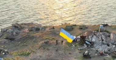 Ukrainian service members install a national flag on Snake (Zmiinyi) Island, Odessa region, Ukraine, July 7, 2022. (Reuters Photo)