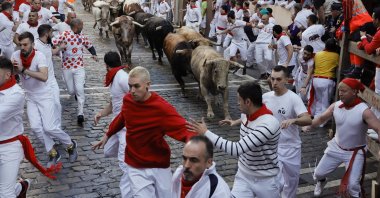 People take part in the traditional Running of the Bulls, Pamplona, Spain, July 7, 2022. (EPA Photo)