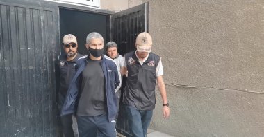 Security forces escort Mehmet Gezer after a court hearing in Turkey's capital Ankara, July 7, 2022. (DHA Photo)