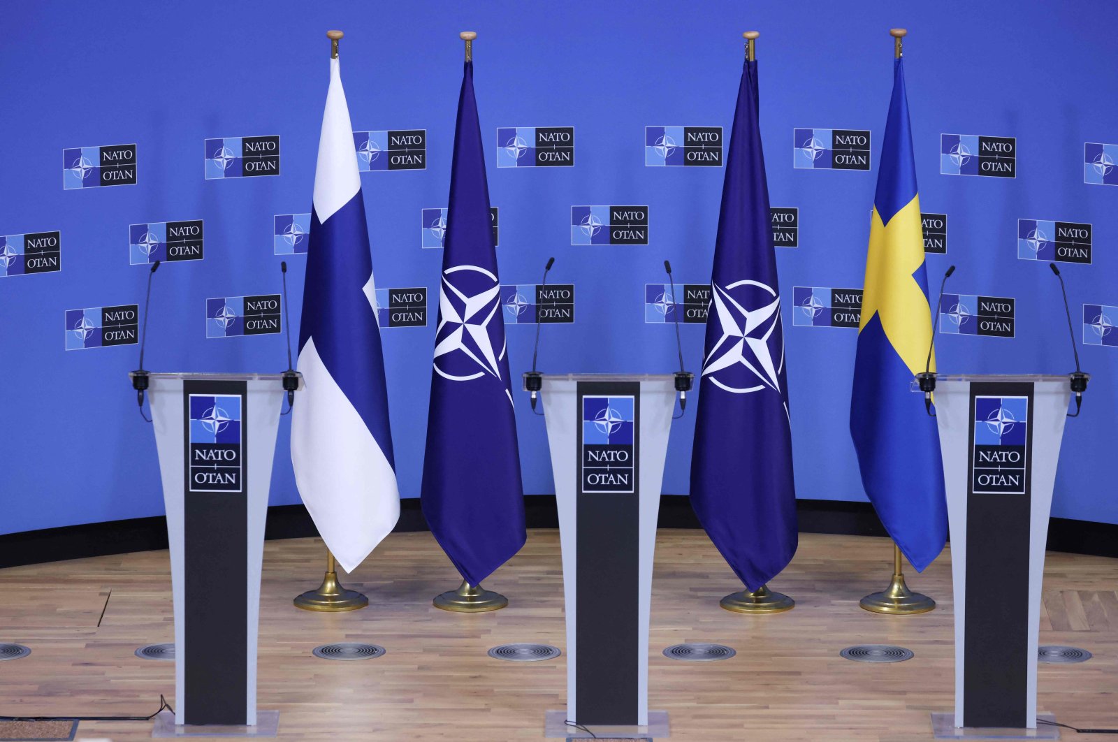 Flags of Finland, NATO and Sweden before a press conference at the NATO headquarters in Brussels, Belgium, July 5, 2022. (AFP Photo)