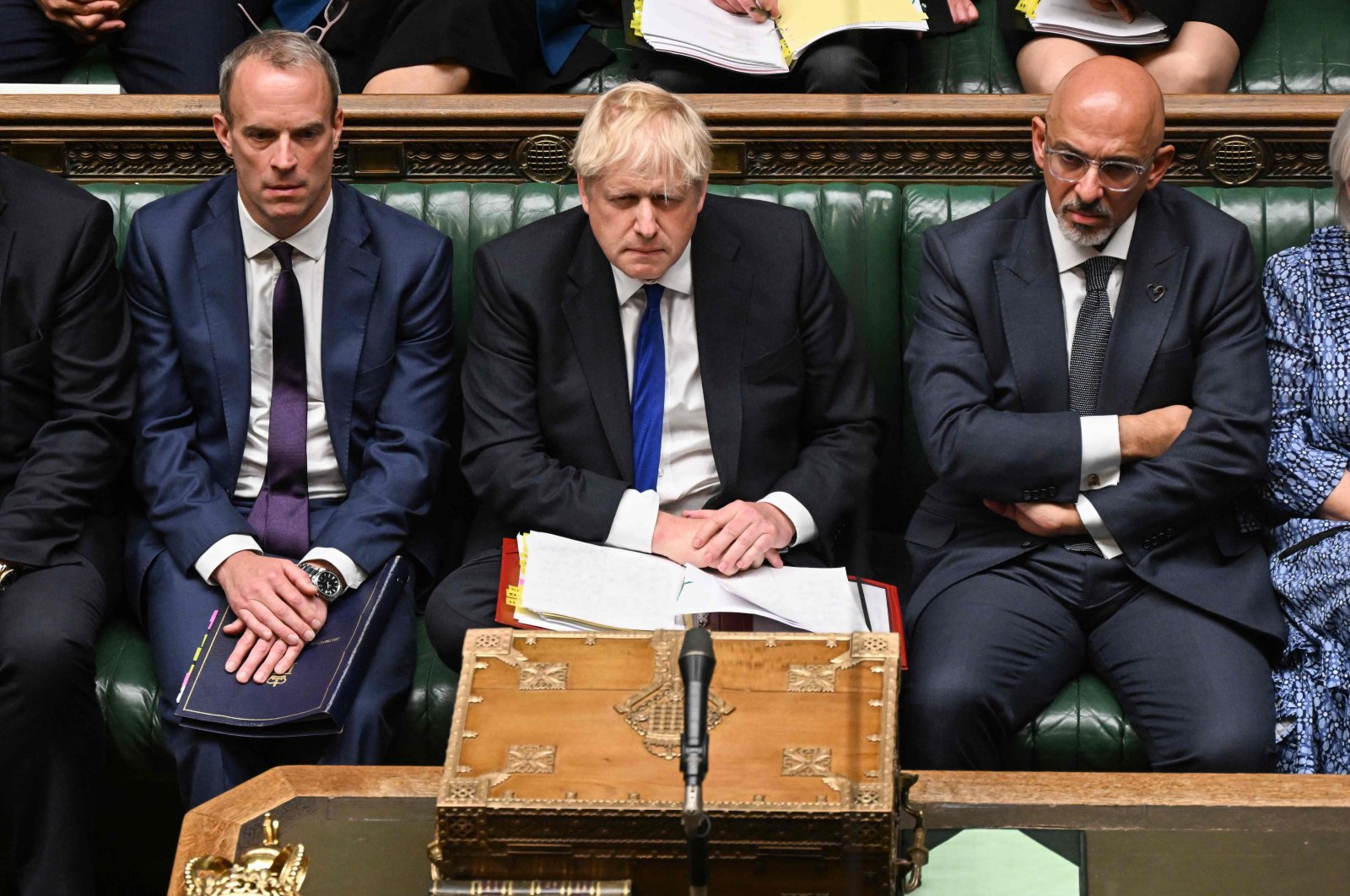 A handout photograph released by the UK Parliament shows Britain&#039;s Prime Minister Boris Johnson (C) flanked by Britain&#039;s Justice Secretary and deputy Prime Minister Dominic Raab (L) and Britain&#039;s new Chancellor of the Exchequer Nadhim Zahawi (R) during prime minister&#039;s questions in the House of Commons in London, U.K., July 6, 2022. (Jessica Taylor via AFP)