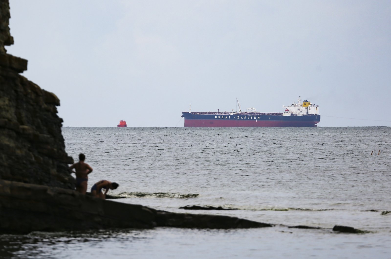 FILE - The Minerva Symphony tanker, which sails under the Greek flag and the terminal of the Caspian Pipeline Consortium, left, are seen at the Black Sea near Novorossiysk, Russia, Aug. 12, 2021. (AP Photo, File)