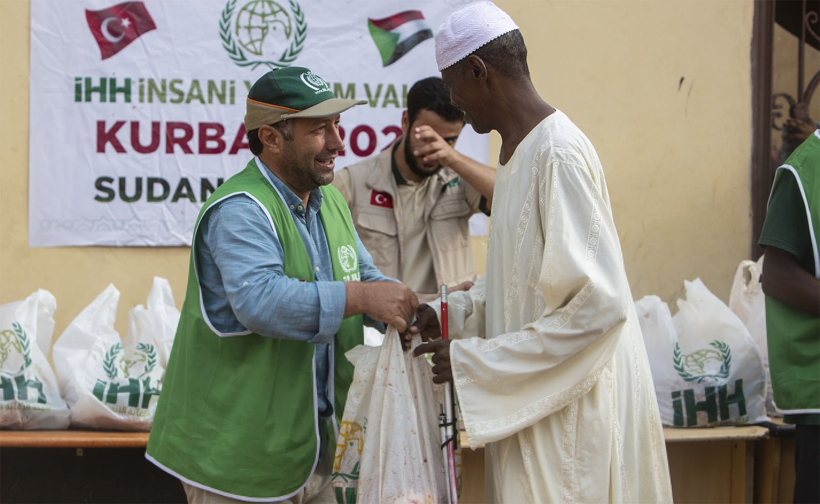 A volunteer from Turkish charity IHH delivers meat in Khartoum, Sudan, July 22, 2021. (Courtesy of IHH)