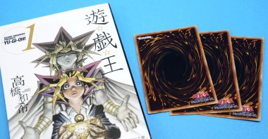 This photo shows "Yu-Gi-Oh!” manga comic and trading cards in Tokyo, Japan, July 7, 2022. (Kyodo News via AP)