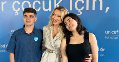Hadise (C) poses with Resul (L) and Nehir, during a UNICEF event in Istanbul, Turkey, July 7, 2022. (Photo by Daily Sabah's Ahmet Koçak)