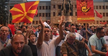Supporters of the opposition party VMRO DPMNE and other citizens shout anti-government slogans, during a protest against the French proposal to resolve the dispute between North Macedonia and Bulgaria in front of the parliament building in Skopje, North Macedonia, July 7, 2022. (EPA Photo)