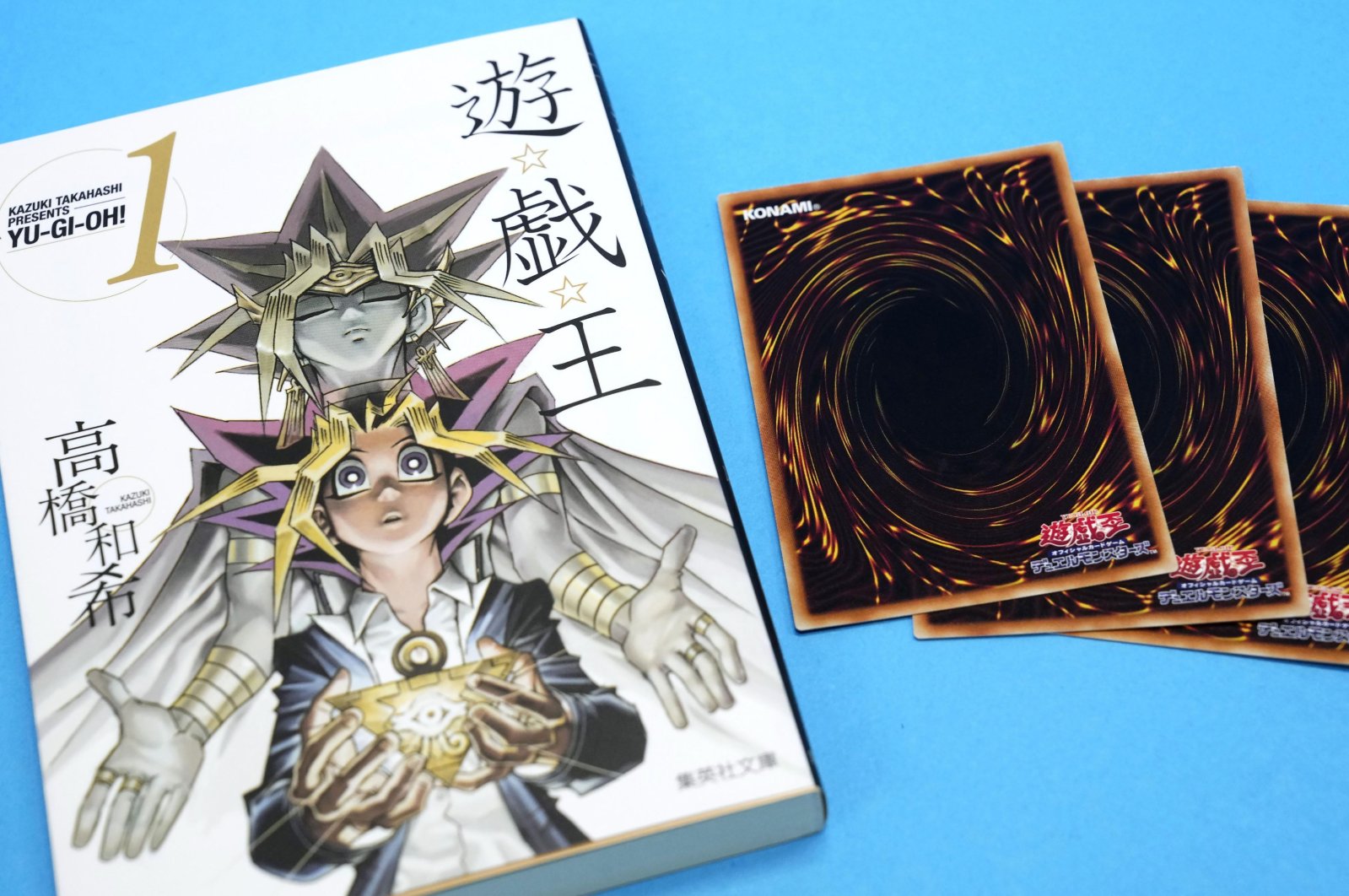 This photo shows &quot;Yu-Gi-Oh!” manga comic and trading cards in Tokyo, Japan, July 7, 2022. (Kyodo News via AP)