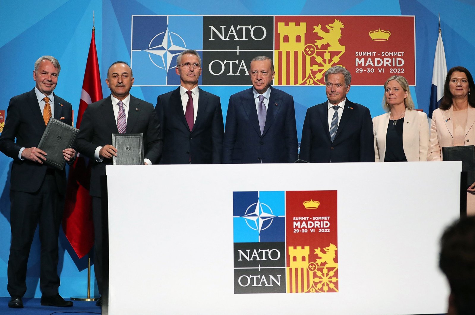 This handout photograph taken and released on June 28, 2022, in Madrid by the Turkish Presidential press office shows (From L) Finnish Foreign Minister Pekka Haavisto, Turkish Foreign Minister Mevlüt Çavuşoğlu, NATO Secretary-General Jens Stoltenberg, President Recep Tayyip Erdoğan, Finland&#039;s President Sauli Niinisto, Sweden&#039;s Prime Minister Magdalena Andersson and Swedish Foreign Minister Ann Linde posing for pictures after signing a memorandum during a NATO summit in Madrid, Spain. (AFP Photo)