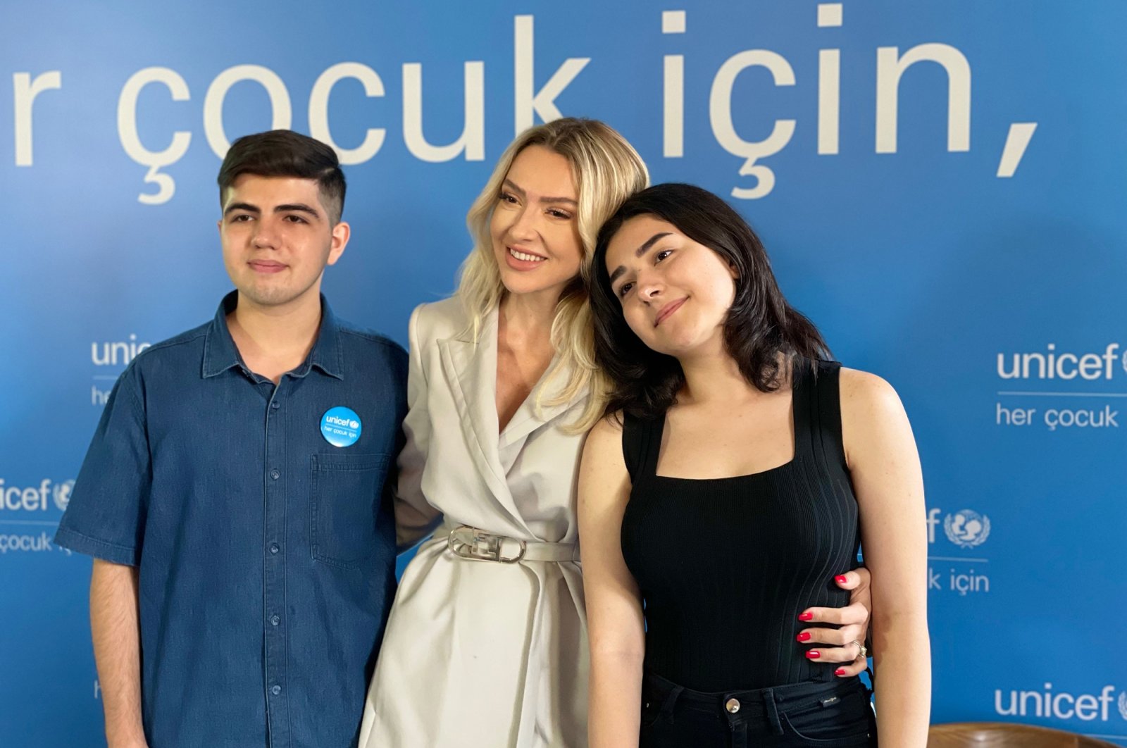 Hadise (C) poses with Resul (L) and Nehir, during a UNICEF event in Istanbul, Turkey, July 7, 2022. (Photo by Daily Sabah&#039;s Ahmet Koçak)