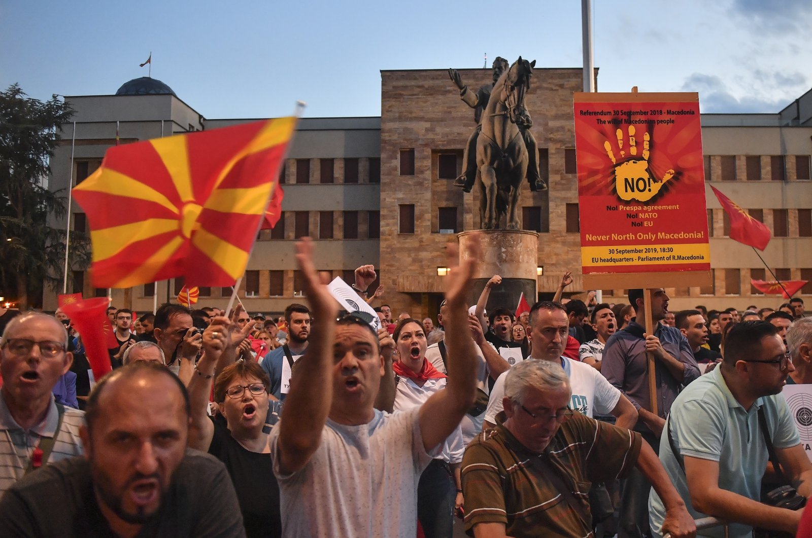 Supporters of the opposition party VMRO DPMNE and other citizens shout anti-government slogans, during a protest against the French proposal to resolve the dispute between North Macedonia and Bulgaria in front of the parliament building in Skopje, North Macedonia, July 7, 2022. (EPA Photo)