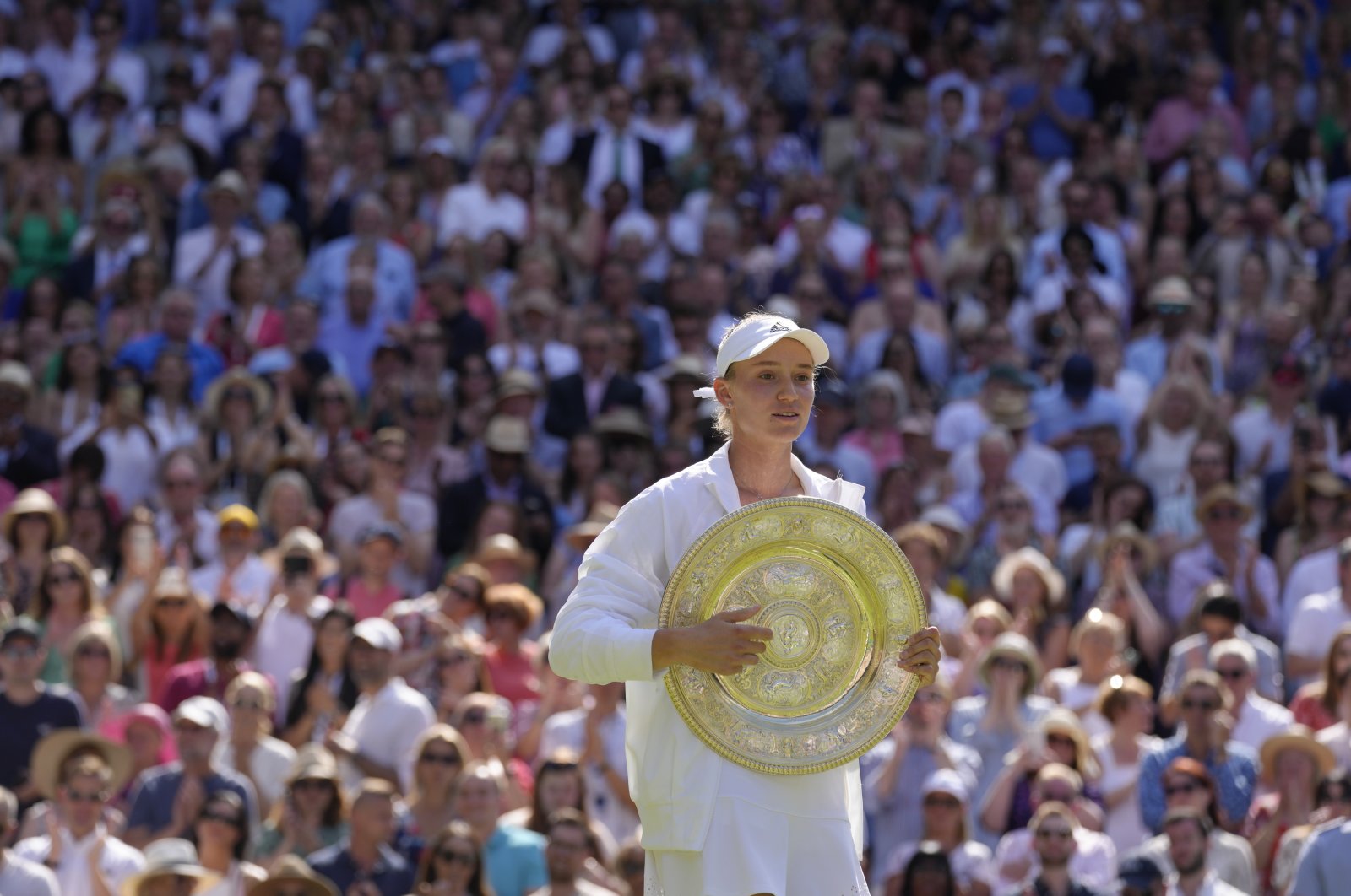 Kazakhstan&#039;s Elena Rybakina holds the trophy as she celebrates after beating Tunisia&#039;s Ons Jabeur to win the final of the women&#039;s singles on Day 13 of the Wimbledon tennis championships in London, U.K., July 9, 2022. (AP Photo)