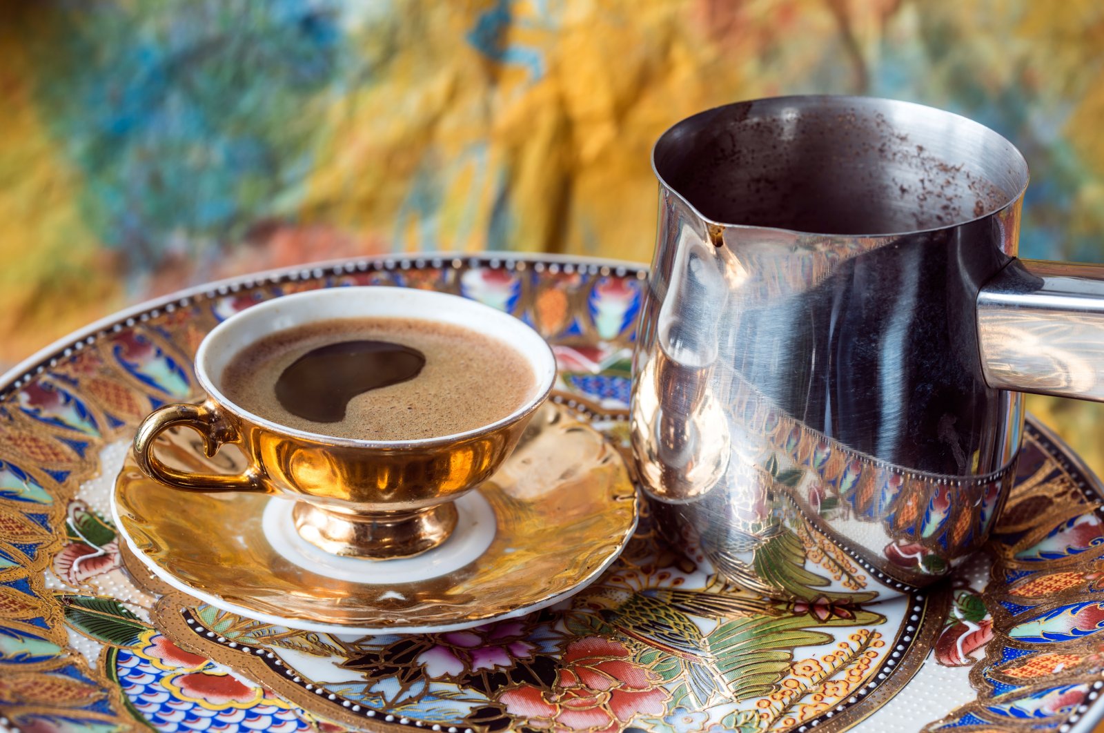 A cup of Turkish coffee next to the traditional pot the drink is brewed in. (Alamy Photo via Reuters)
