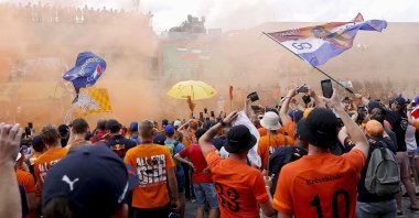 Fans celebrate during the winners' ceremony after the F1 Austrian GP, Spielberg, Austria, July 10, 2022. (AFP Photo)