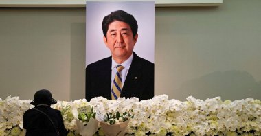 A mourner pays respects to late former Japanese Prime Minister Shinzo Abe, who was shot while campaigning for a parliamentary election, in Taipei, Taiwan, July 11, 2022.  (Reuters Photo)