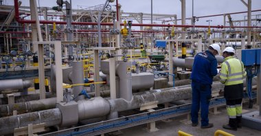 Operators work at the Enagas regasification plant, the largest LNG plant in Europe, in Barcelona, Spain, March 29, 2022. (AP Photo)