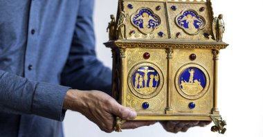 Dutch art detective Arthur Brand poses with the artwork Precieux Sang (Precious Blood) in Amsterdam, The Netherlands, July 11, 2022. (EPA Photo)