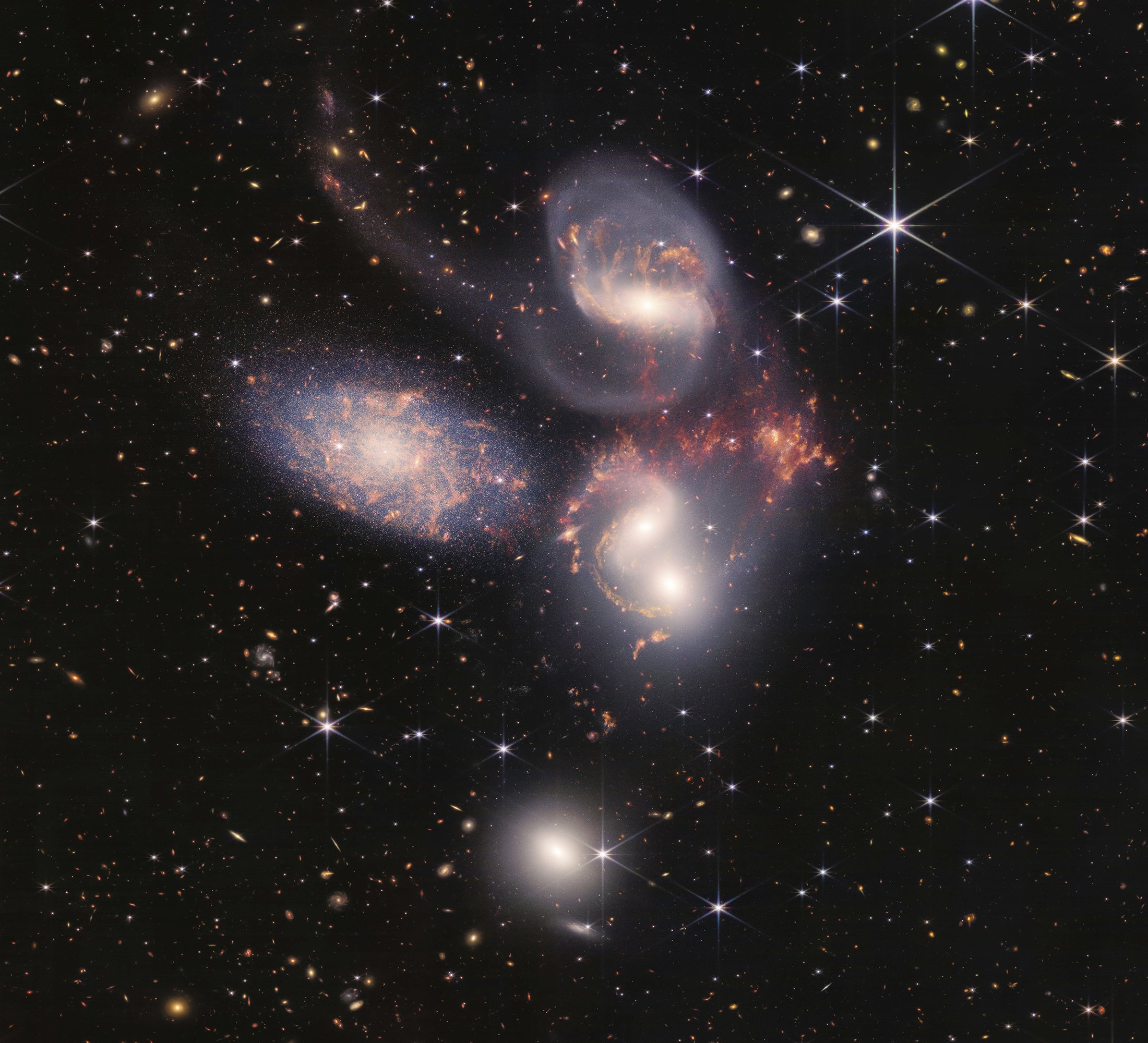 The Stephan's Quintet, a visual grouping of five galaxies captured by the Webb Telescope's Near-Infrared Camera (NIRCam) and Mid-Infrared Instrument (MIRI), July 12, 2022. (AP Photo)