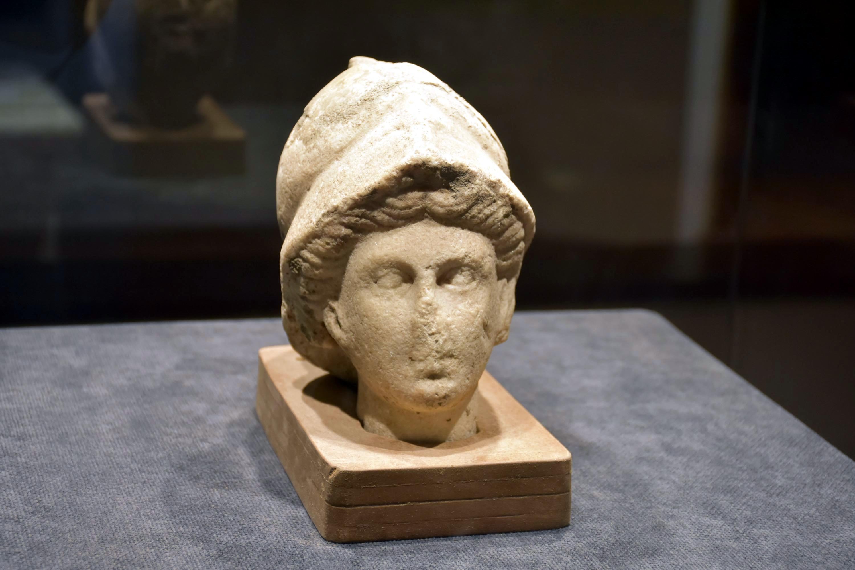 An 18-centimeter-tall marble Athena head on display at the Izmir Archaeological Museum, western Turkey, July 12, 2022. (AA Photo)