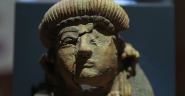 A 28-centimeter terracotta Athena statue, unearthed in the excavations in the Bayraklı district, on display at the Izmir Archaeological Museum, western Turkey, July 12, 2022. (AA Photo)