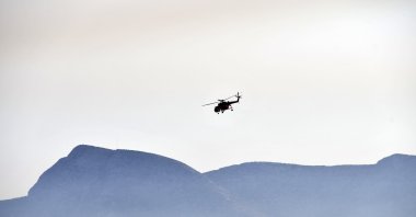 A helicopter takes part in a search and rescue operation near the Aegean island of Samos, Greece, July 13, 2022. (AP Photo)