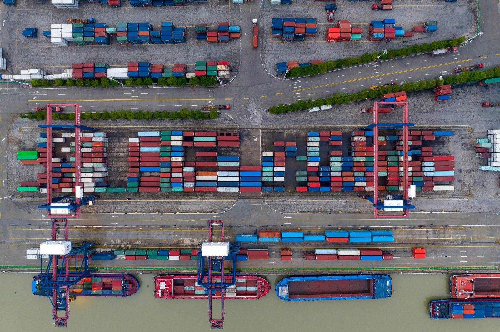 This aerial photo shows cargo containers stacked at a port in Huaian, in China&#039;s eastern Jiangsu province, July 4, 2022. (AFP Photo)