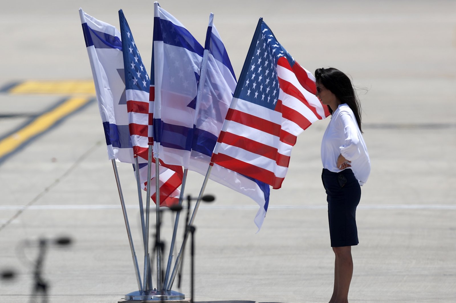An official stands near a display of U.S. and Israeli flags at Ben Gurion Airport ahead of the arrival of U.S. President Joe Biden, Lod, near Tel Aviv, Israel, July 13, 2022. (EPA Photo)