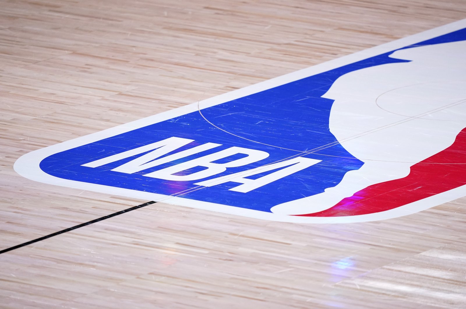 The NBA logo is seen on the court floor during a match Lake Buena Vista, U.S., Sept. 22, 2020. (AP Photo)