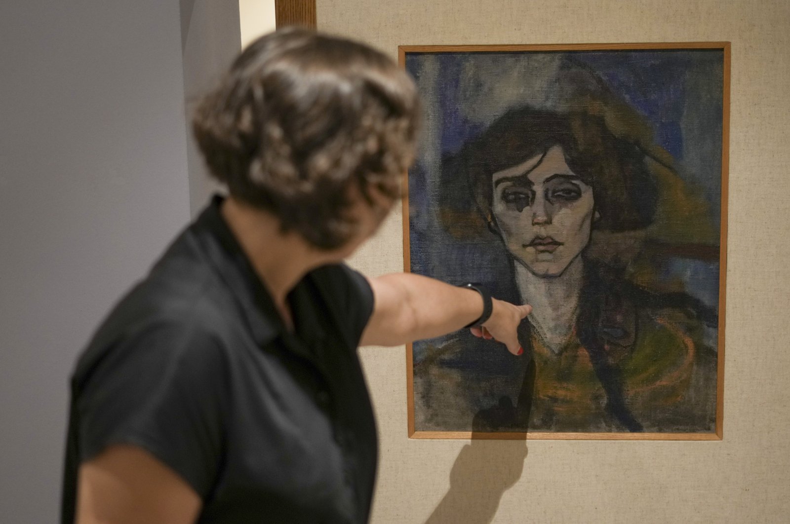 Inna Berkowits, an art historian at the Haifa University&#039;s Hecht Museum explains about Amadeo Modigliani&#039;s painting &quot;Maud Abrantes&quot; that is painted on the reverse side of a canvas with another painting by him titled, &quot;Nude with a Hat,” and is on display at Haifa University&#039;s Hecht Museum in Haifa, Israel, June 28, 2022. (AP)
