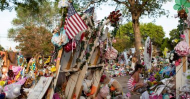 A girl looks on at a memorial outside Robb Elementary School the day after video was released showing the May shooting inside the school in Uvalde, Texas, U.S., July 13, 2022. (Reuters Photo)