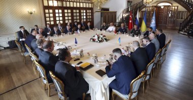 Russian (top L) and Ukrainian (R) delegations meet along with United Nations observers (L) and Turkish Defense Ministry members in Istanbul, Turkey, July 13, 2022. (Turkish Defense Ministry via AP)