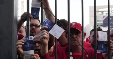 Fans show tickets before the Champions League final match, Paris, France, May 28, 2022. (AP Photo)