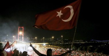 People wave national flags near then-Bosporus Bridge after July 15 failed coup attempt, in Istanbul, Turkey, July 22, 2016. (AA Photo)

