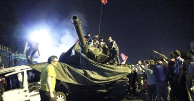 People take over a tank controlled by coup plotters, in Istanbul, Turkey, July 15, 2016. (AA Photo)