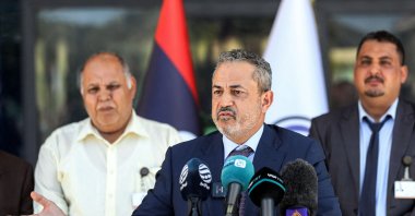 Farhat Bengdara, the new chief of Libya's National Oil Corporation who was appointed by the Tripoli-based Prime Minister Abdul Hamid Mohammed Dbeibah, gives a press conference outside the corporation's headquarters in the capital Tripoli, Libya, July 14, 2022. (AFP Photo)