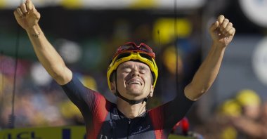 Stage winner Britain's Thomas Pidcock celebrates as he crosses the finish line of the 12th stage of the Tour de France cycling race over 165.5 kilometers (102.8 miles) with start in Briancon and finish in Alpe d'Huez, France, July 14, 2022. (AP Photo)
