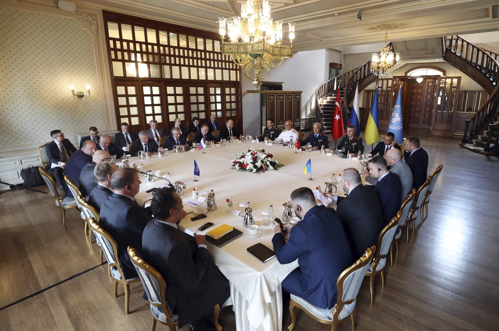 Russian (top L) and Ukrainian (R) delegations meet along with United Nations observers (L) and Turkish Defense Ministry members in Istanbul, Turkey, July 13, 2022. (Turkish Defense Ministry via AP)