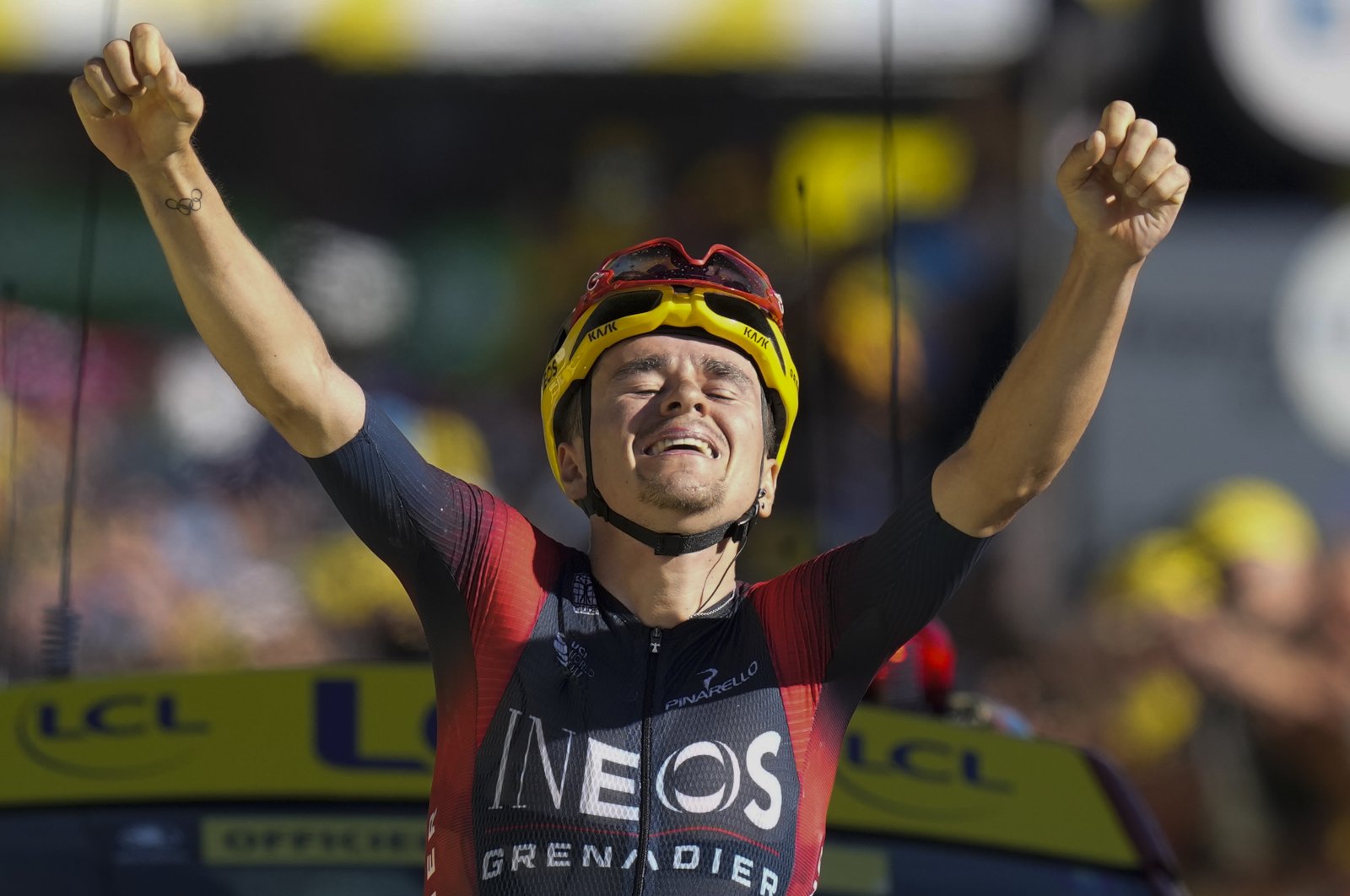Stage winner Britain&#039;s Thomas Pidcock celebrates as he crosses the finish line of the 12th stage of the Tour de France cycling race over 165.5 kilometers (102.8 miles) with start in Briancon and finish in Alpe d&#039;Huez, France, July 14, 2022. (AP Photo)