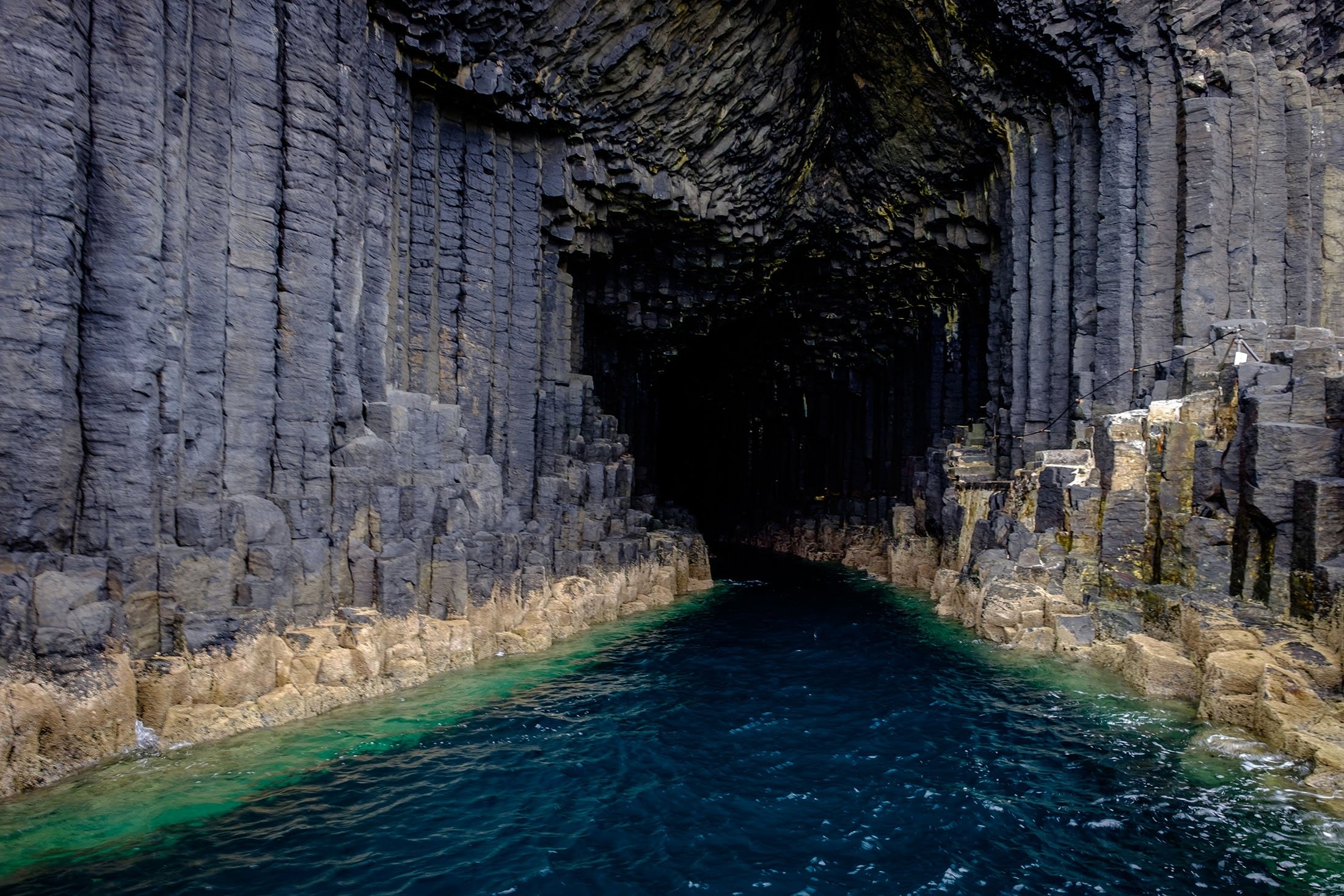 Fingal's Cave in Scotland has a wide arched entrance and is filled with seawater. (Photo Shutterstock)