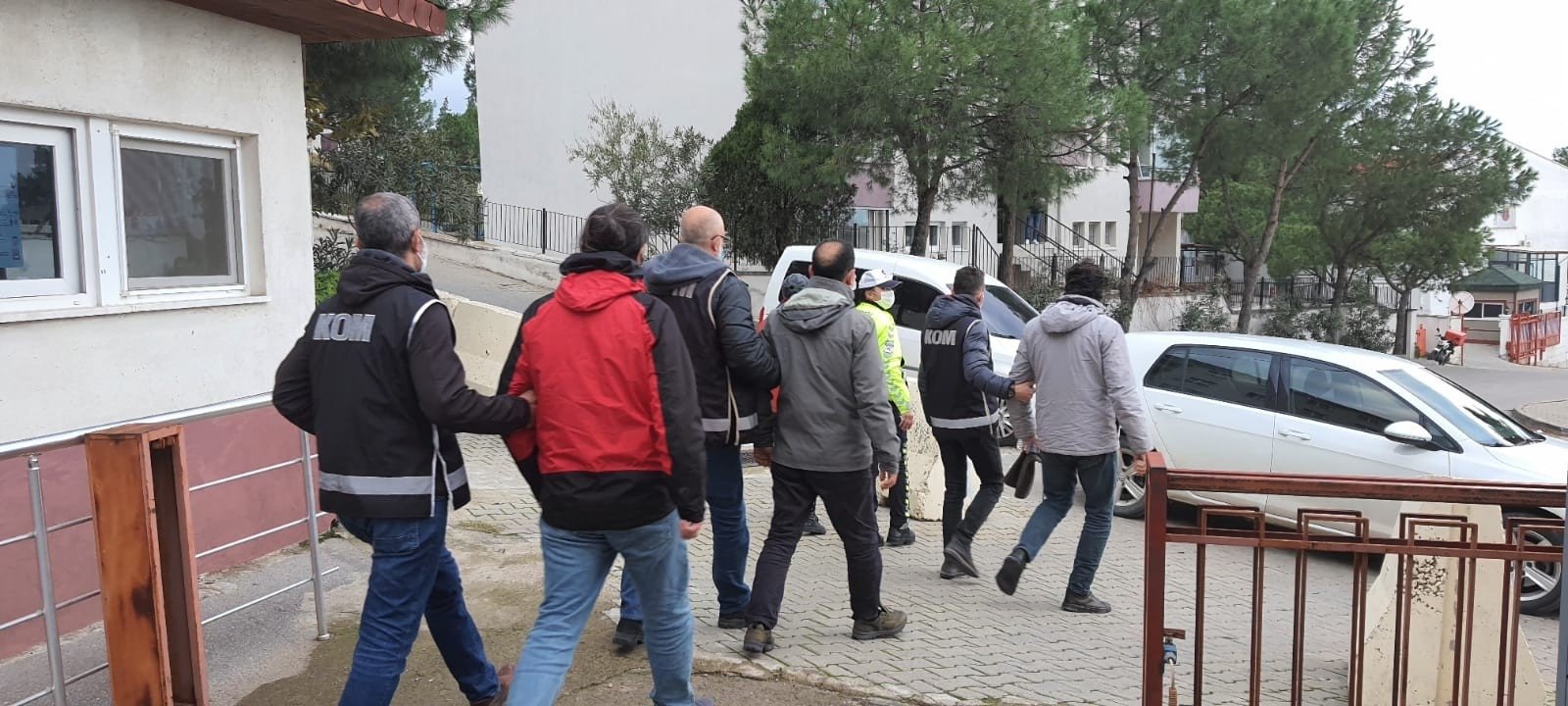 Police escort four FETÖ suspects captured en route to Greece, in Balıkesir, western Turkey, Aug. 12, 2021, (İHA PHOTO) 