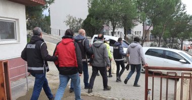 Police escort four FETÖ suspects captured en route to Greece, in Balıkesir, western Turkey, Aug. 12, 2021, (İHA PHOTO) 