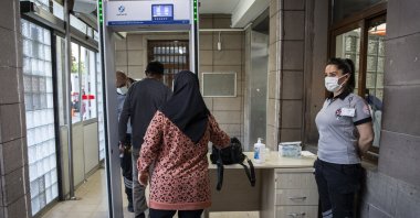People pass through a metal detector at a hospital in the capital Ankara, Turkey, July 14, 2022. (AA PHOTO)