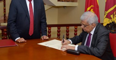 A handout photo made available by the Sri Lankan President's Media Division shows Sri Lankan Prime Minister Ranil Wickremesinghe (R) signing a document after taking the oath as interim president of Sri Lanka before Chief Justice Jayantha Jayasuriya (L), Colombo, Sri Lanka, 15 July 2022. (Sri Lankan President's Media Division via EPA Photo)