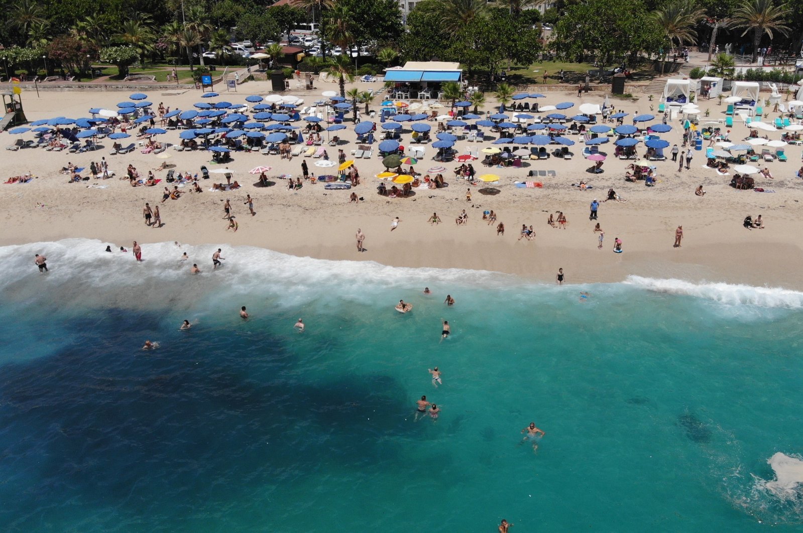 Vacationers enjoy the sea at a beach in Antalya, southern Turkey in this photo republished on July 14, 2022. (IHA Photo)