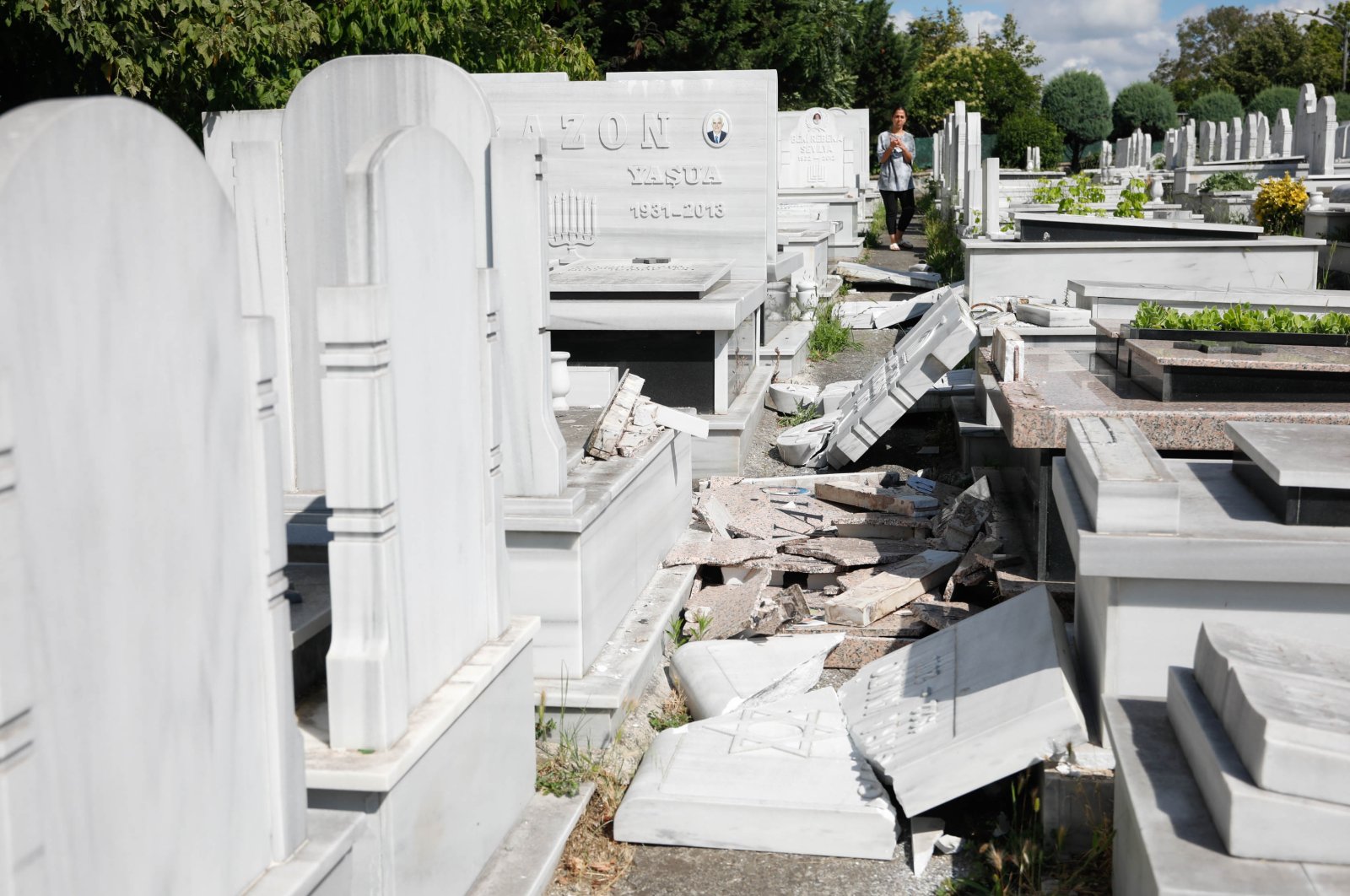 A view of broken gravestones at the cemetery, in Istanbul, Turkey, July 15, 2022. (DHA Photo)