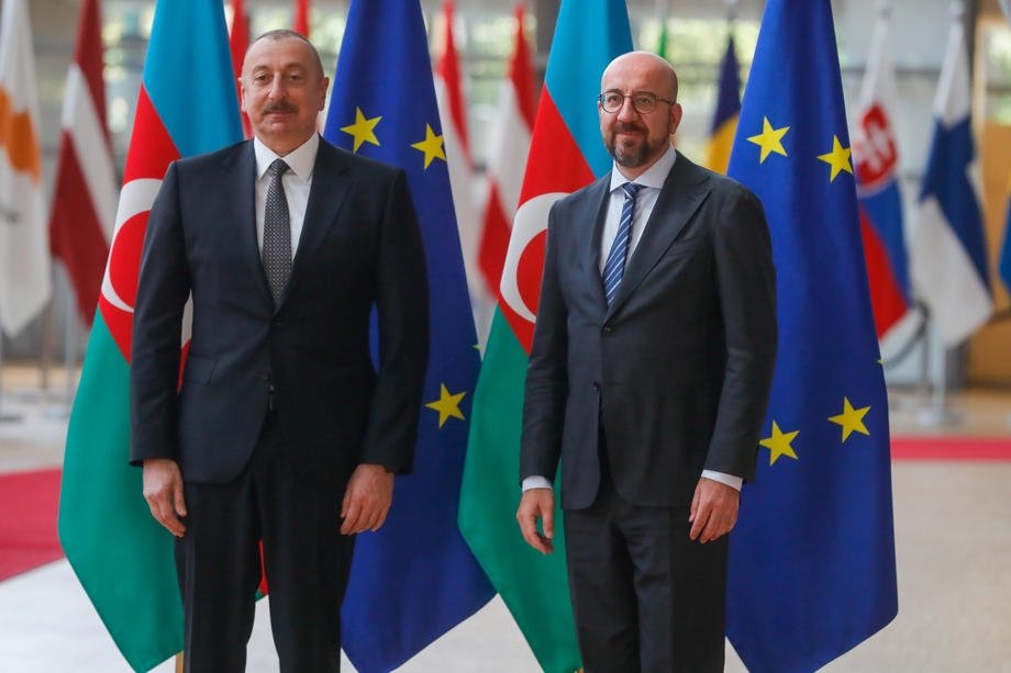 Azerbaijani President Ilham Aliyev (L) is welcomed by the President of the European Council Charles Michel (C) ahead of a meeting at the European Council in Brussels, Belgium, May 22, 2022. (EPA Photo)