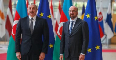 Azerbaijani President Ilham Aliyev (L) is welcomed by the President of the European Council Charles Michel (C) ahead of a meeting at the European Council in Brussels, Belgium, May 22, 2022. (EPA Photo)